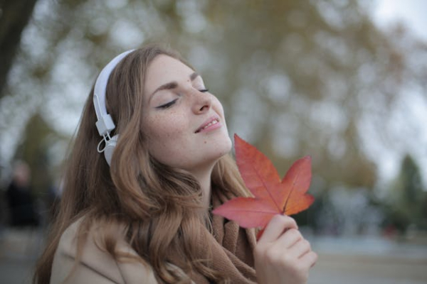 Photo by Andrea Piacquadio: https://www.pexels.com/photo/young-satisfied-woman-in-headphones-with-fresh-red-leaf-listening-to-music-with-pleasure-while-lounging-in-autumn-park-3776557/ Photo by Andrea Piacquadio: https://www.pexels.com/photo/young-satisfied-woman-in-headphones-with-fresh-red-leaf-listening-to-music-with-pleasure-while-lounging-in-autumn-park-3776557/